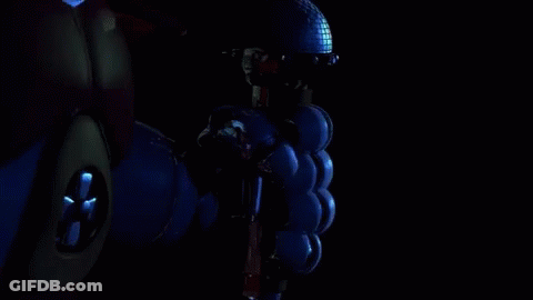 A Robotic Hand Is Giving A Thumbs Up In The Dark . GIF