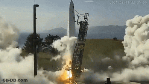 A Rocket Is Being Launched Into Space From A Launch Pad . GIF