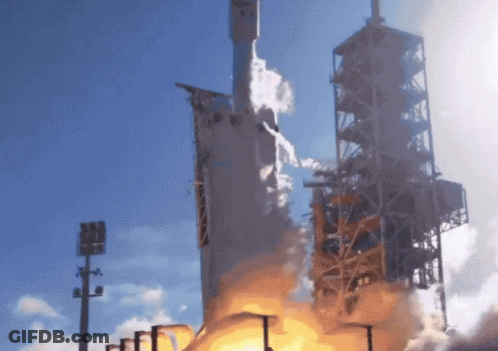 A Rocket Is Being Launched Into The Sky With Smoke Coming Out Of It GIF