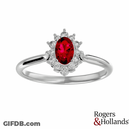 A Rogers And Hollands Ring With A Red Stone In The Center GIF