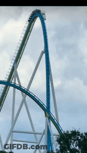 A Roller Coaster Is Going Up A Very Steep Curve GIF