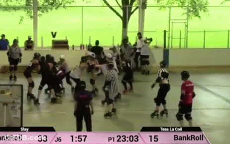 A Roller Derby Game Is Being Played On A Rink GIF