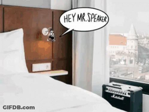 A Room With A Bed And A Speaker That Says Hey Mr Speaker GIF