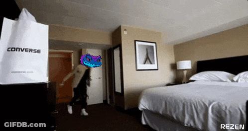 A Room With A Converse Bag And A Bed GIF