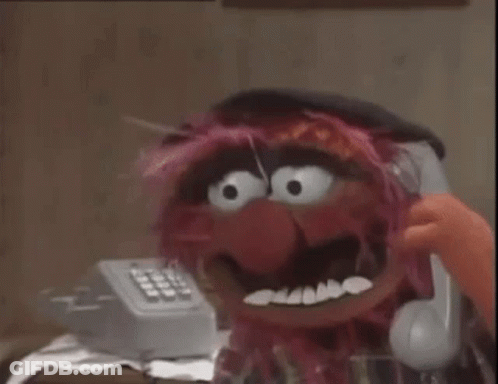 A Room With A Dresser And A Telephone With The Numbers 1 Through 9 On It GIF