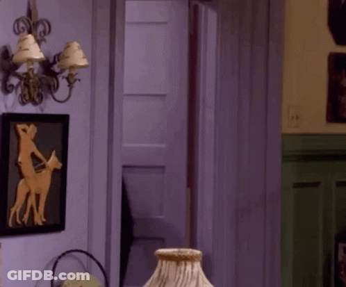 A Room With A Lamp And A Picture Of A Man Riding A Horse GIF