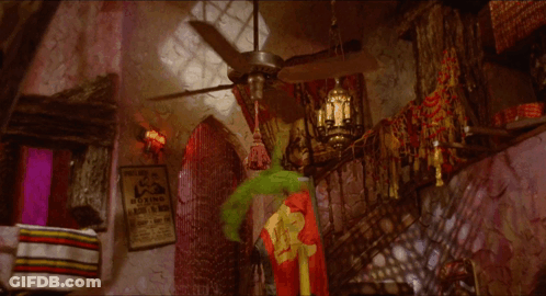 A Room With A Poster On The Wall That Says " Boxing " GIF
