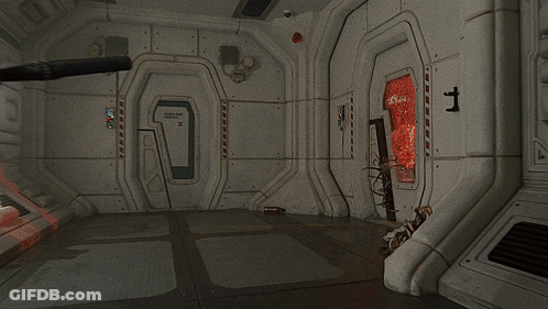 A Room With A Red Door That Says " Fire " On It GIF