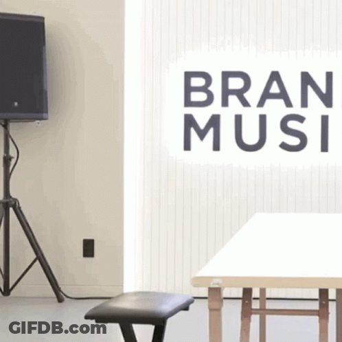 A Room With A Sign That Says Bran Music On It GIF