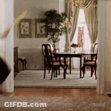 A Room With A Starz Logo On The Wall GIF