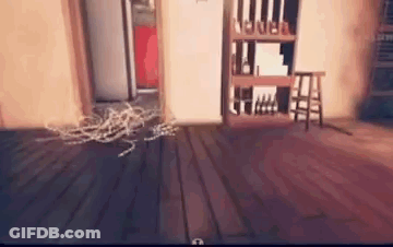 A Room With A Wooden Floor , A Shelf , A Stool And A Door . GIF