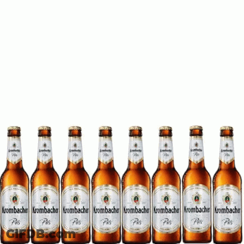 A Row Of Bottles Of Krombacher Beer Are Lined Up In A Row GIF