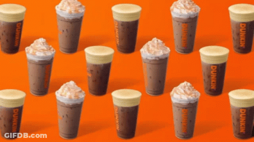 A Row Of Dunkin 'S Coffee Cups On An Orange Background GIF
