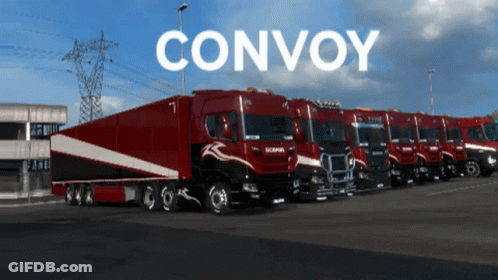 A Row Of Red Trucks Are Parked In A Parking Lot With The Word Convoy On The Bottom GIF