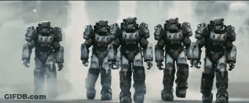 A Row Of Robotic Soldiers Are Lined Up In A Line GIF