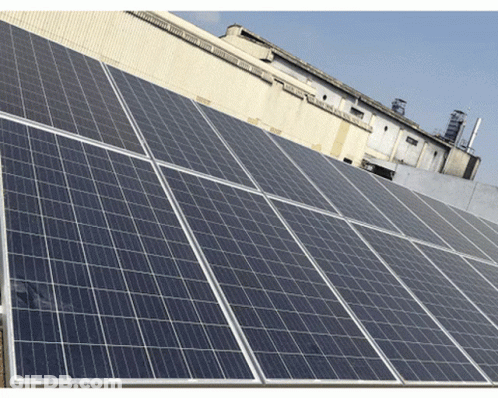 A Row Of Solar Panels On Top Of A Roof GIF