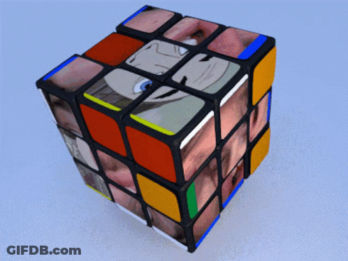 A Rubik 'S Cube With A Picture Of A Man On It GIF
