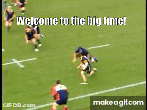 A Rugby Game Is Being Played On A Field With The Words Welcome To The Big Time On The Bottom Of The Screen . GIF