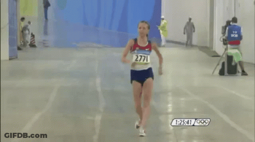 A Runner With The Number 2711 On Her Shirt GIF