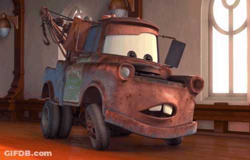A Rusty Tow Truck From The Movie Cars Is Standing In Front Of A Window GIF
