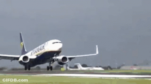 A Ryanair Airplane Is Flying Through The Air GIF