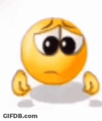 A Sad Smiley Face With A Tear Coming Out Of Its Eyes Is Sitting On The Ground . GIF