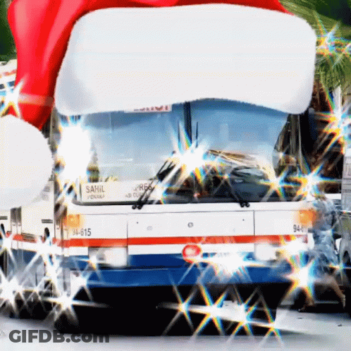 A Sahil Bus With A Santa Hat On The Front GIF