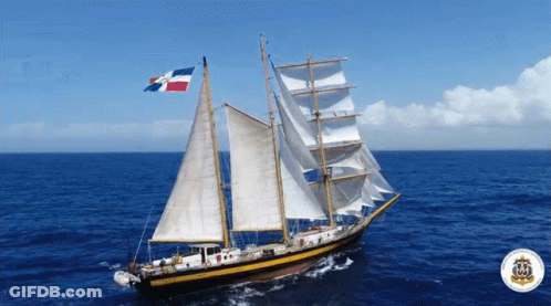 A Sailboat In The Ocean With A Dominican Flag On Top GIF