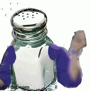 A Salt Shaker With Purple Gloves On It Is Being Held By A Person . GIF