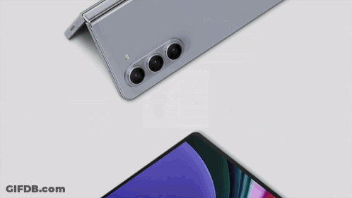 A Samsung Phone And A Tablet Are Laying On A Table GIF