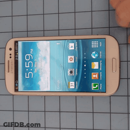 A Samsung Phone With The Time Of 5:59 On The Screen GIF