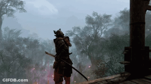 A Samurai With A Sword Is Standing In The Middle Of A Forest GIF