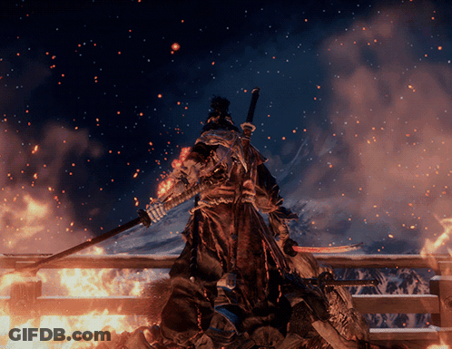 A Samurai With A Sword Stands In Front Of A Fire GIF