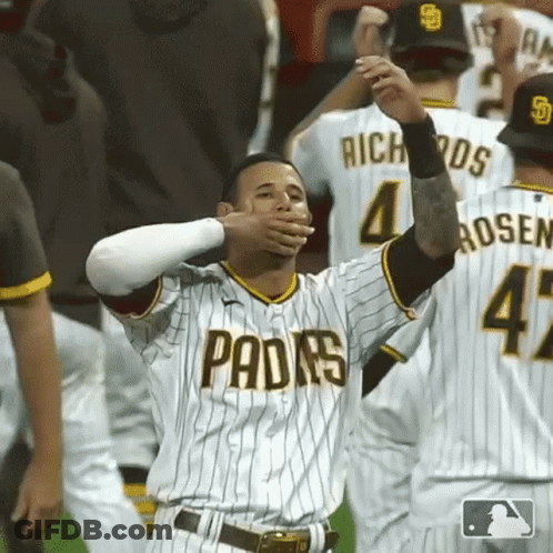 A San Diego Padres Baseball Player Is Covering His Mouth With His Hands GIF