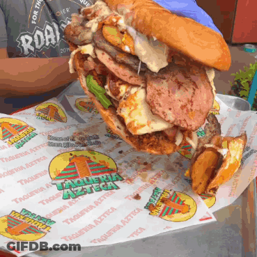 A Sandwich With A Lot Of Meat And Cheese Is On A Piece Of Paper That Says Taqueria Azteca On It GIF