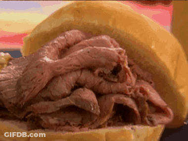A Sandwich With Sliced Roast Beef On A Bun GIF