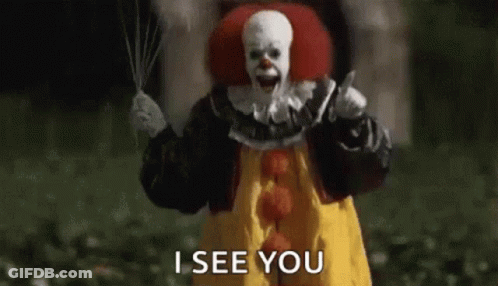 A Scary Clown Is Holding A Knife And A Balloon . GIF