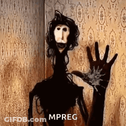 A Scary Puppet Is Standing In Front Of A Wall And Waving At The Camera . GIF