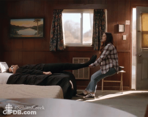 A Scene From Schitt 'S Creek Is Shown In A Bedroom GIF