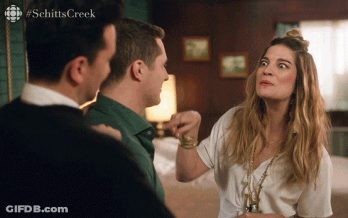 A Scene From Schitt 'S Creek With A Woman Making A Face GIF