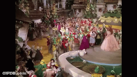 A Scene From The Movie The Wizard Of Oz With A Lot Of People GIF