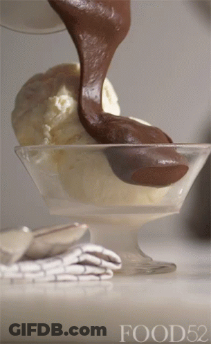 A Scoop Of Ice Cream Is Being Poured Into A Bowl With Food52 Written On The Bottom GIF