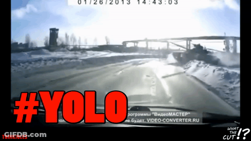A Screen Shot Of A Car Driving Down A Snowy Road With The Words #Yolo In Red GIF