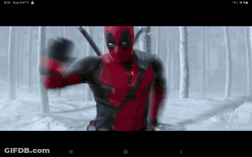 A Screen Shot Of A Deadpool Movie On A Cell Phone GIF