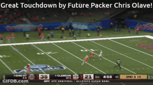 A Screen Shows A Football Game Between Ohio St And Clemson At The Allstate Sugar Bowl GIF