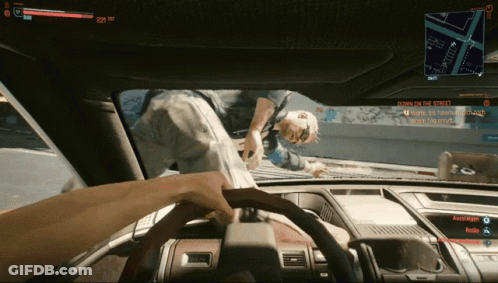 A Screenshot Of A Video Game Shows A Person In The Driver 'S Seat And The Screen Says Down On The Street GIF