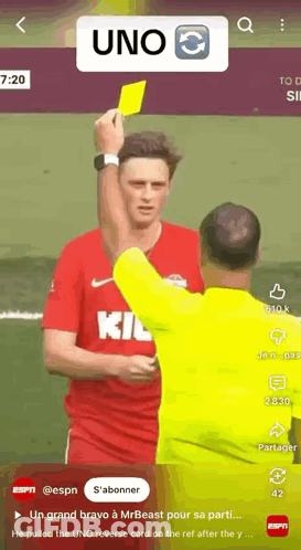 A Screenshot Of A Video Of A Referee Giving A Yellow Card To A Soccer Player GIF