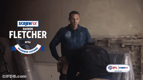 A Screwfix Ad With Darren Fletcher Standing Next To Another Man GIF