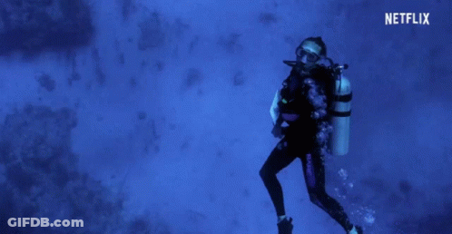 A Scuba Diver Is Swimming In The Ocean With A Netflix Logo In The Background GIF