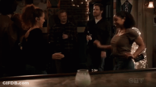 A Seahawks Banner Hangs On The Wall Above A Bar GIF